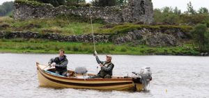 2 men fishing on a boat