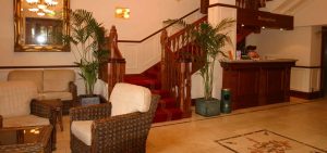 Reception area with staircase leading to rooms