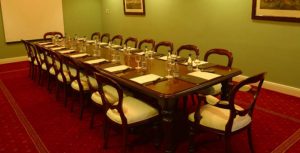 Boardroom with a long table and chairs around