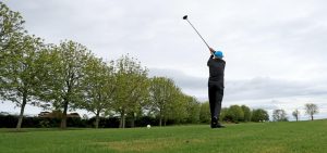 Man taking a swing with golf club