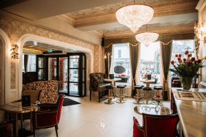 Restaurant setting with couches and bar stools