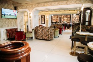 Restaurant setting with couches and bar stools