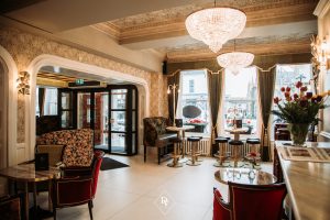Restaurant setting with couches and bar stools